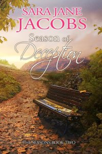 Autumn scene with a path covered in leaves, a wooden bench holding a book, and mountains in the background. The cover reads "Season of Deception."